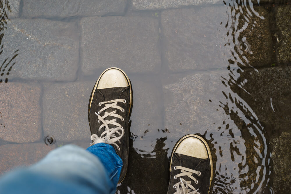 wet shoes in puddle