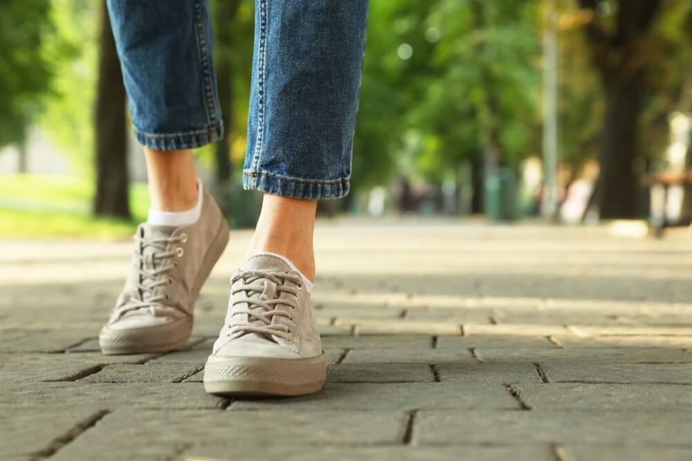 woman walking in sneakers